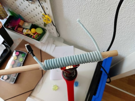 Heating the cable with the heat gun.