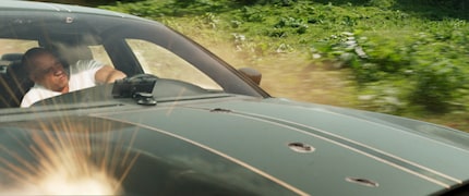 Despite gunshot punctures in the hood, the Charger just keeps going. Dom and his cars are invulnerable.