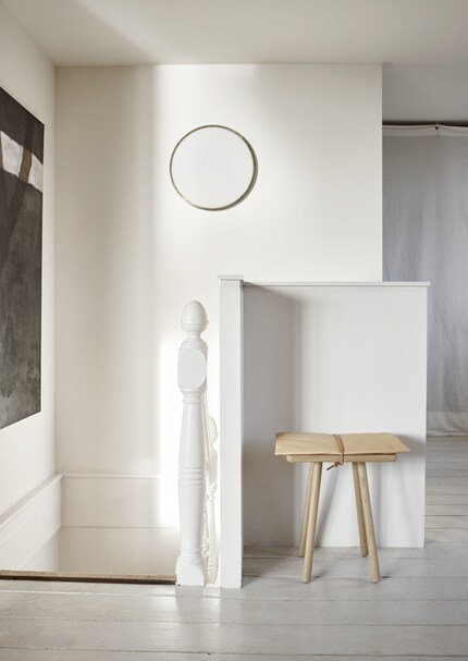 A stool finds a home in this corner and spruces it up at the same time.