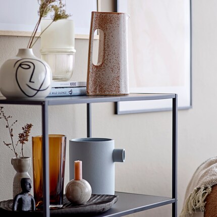 Well camouflaged: The ceramic jug shares the same tone as the wall.