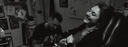 Mireille being tattooed by artist Levente at Piink studio in Basel in XPan Mode