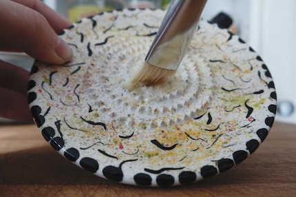 Simply brush the garlic paste into the dish.