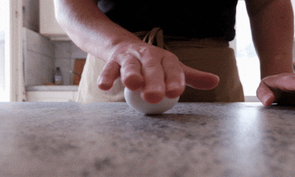 Rolling an egg like a pro.