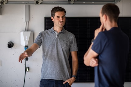 Hans Fischer usually charges his electric VW ID.4 at the wall box in his garage at home.