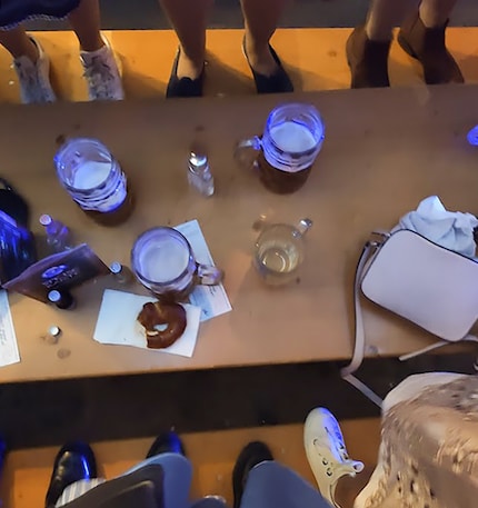Everybody’s up on the benches, leaving a half-eaten pretzel on the table.