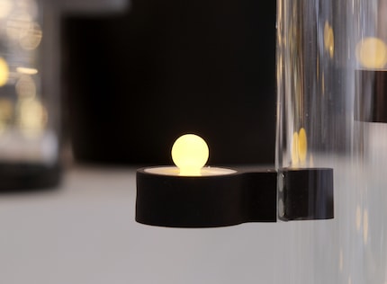 You can put magnetic LED tea lights in many places.