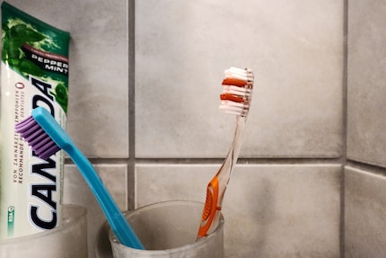 One toothbrush without and one with dosage indication.