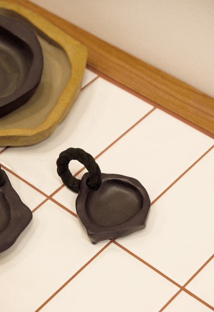 Mixed up: Natalia Brilli combines leather and ceramics in a small bowl.