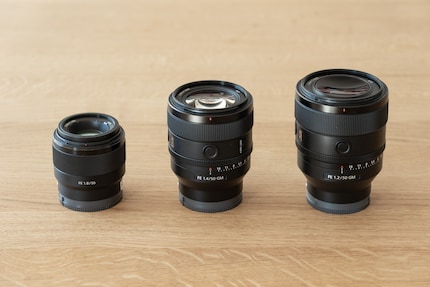 The 50 mm F1.4 GM (centre) ranks between the F1.8 (left) and F1.2 GM (right).