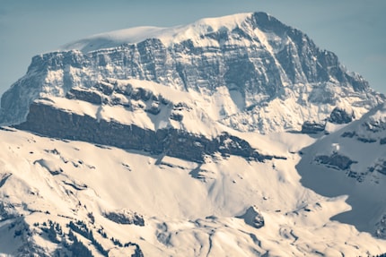 Standing over 50 kilometres away, using a 900-millimetre lens, I can’t really get the mountain into focus.