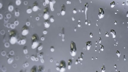 Raindrops on a window pane.