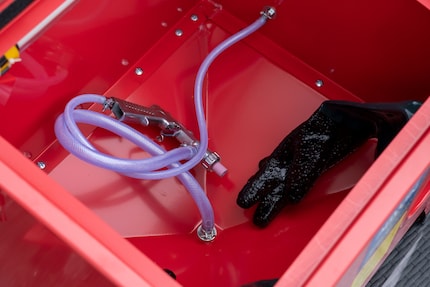 I attach the hoses through the holes in the casing.
