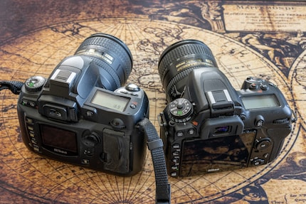 You can tell the age of the Nikon D70 (left) by the small screen. On the right, the Nikon D7500.