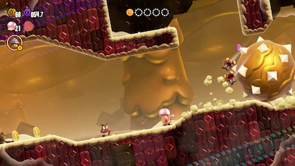 Toadette s’enfuit devant une balle tueuse géante, à la manière d’Indiana Jones.