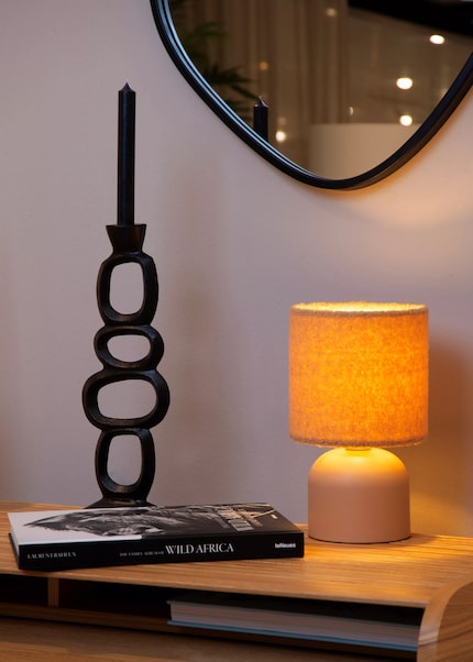 The Woolly table lamp has both a soft shade and a soft glow.