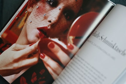 Regularly checking your lipstick in the mirror is a must, as red lipsticks tend to develop a life of their own. Image from the book «Face Paint» by Lisa Eldridge.