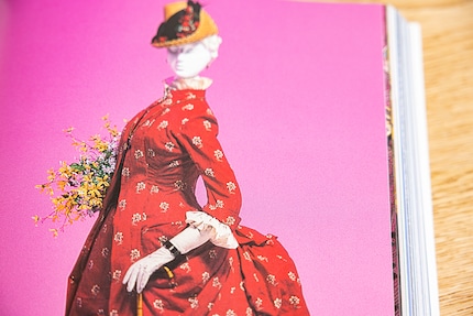 A day dress from 1885 in the style of the robe à la polonaise. Image from the book Fashion History from the 18th to the 20th Century.