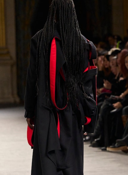 Anti-fashion master Yohji Yamamoto likes to add red accents.