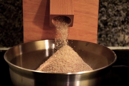 The first batch that trickled out of the flour spout was still too coarse, so I ground it again.