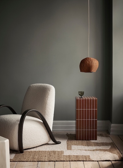 Almost anything goes in terms of height when you’re hanging your lamp above a piece of furniture.
