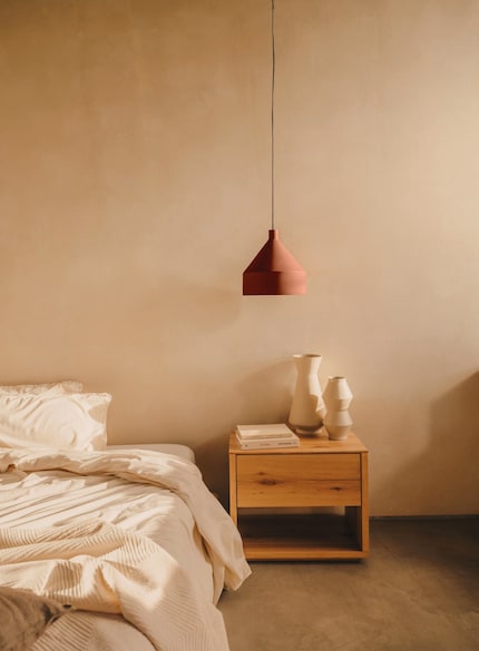 As pendant lights hang from the ceiling, they’ll save space on the bedside table.