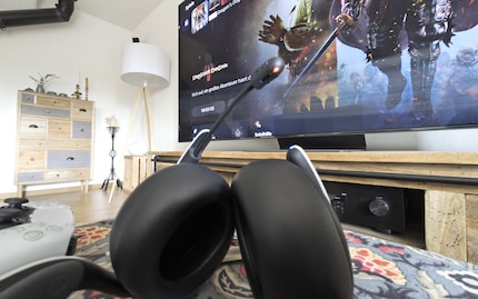 The microphone is retractable and has a mute button.
