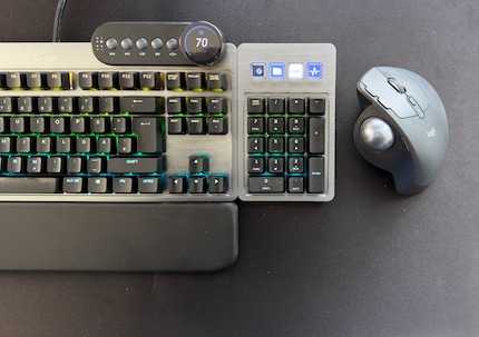 The buttons and dial above the F keys are handy for playing videos or adjusting the volume.