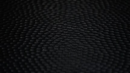 The anti-reflective coating diffuses ambient light. According to Apple, it doesn’t lead to less contrast.