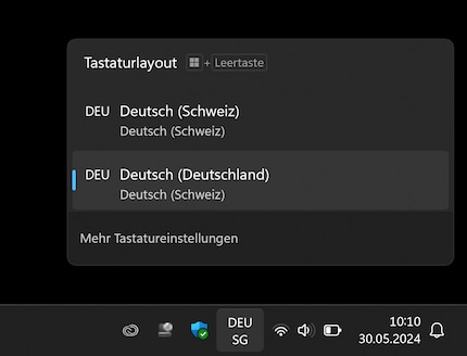 Instead of pressing Windows key + space bar, you can also change the language by clicking on the corresponding icon in the taskbar (here «DEU SG», i.e. German (Switzerland)).