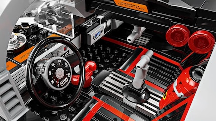 The interior conceals many details. For example, the red Bat-Phone.