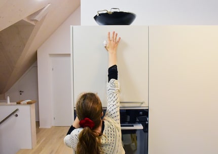 Kitchen struggles – who put the wok up there?