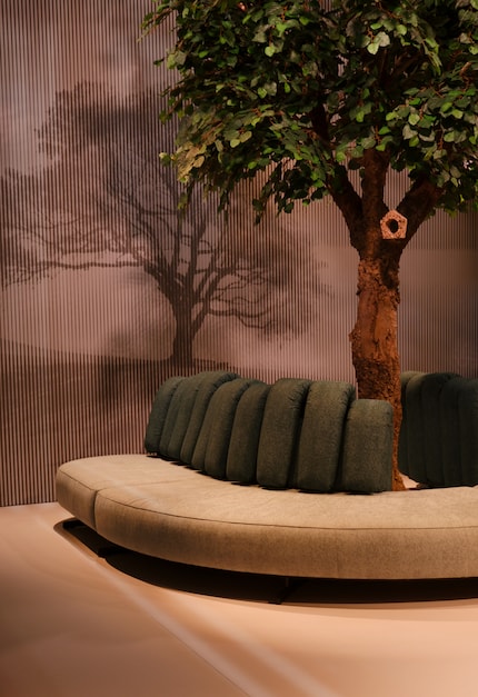 Organic shapes are often combined with luxurious materials such as velvet or bouclé. This design by Flexform even uses textured fabrics.