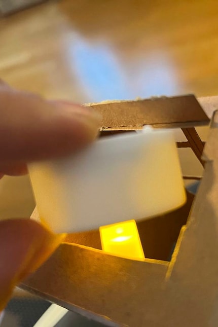 The hole for the LED tea light isn’t a perfect solution, but it works.