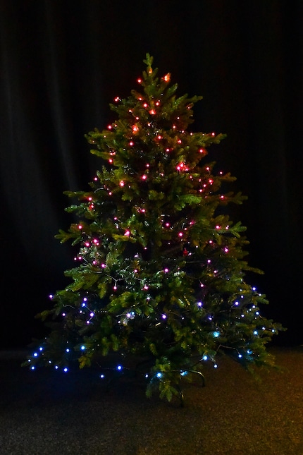 The 150-centimetre Christmas tree glowing in the «Festive atmosphere» scene.