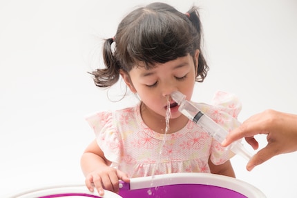 In one nostril, out the other. There are definitely more pleasant alternatives than nasal irrigation.