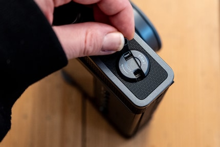 You print the pictures by turning this crank.