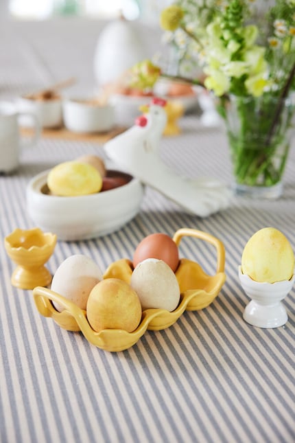 A ceramic egg tray brings structure to your table setting…