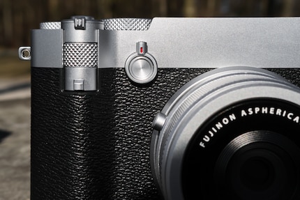 The zoom lever is located under the shutter release, with the new 5-way control on the right.