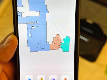 The office is divided into two rooms, and the robot merges the rest into one room.