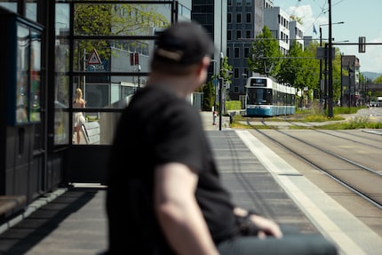 Waiting for the tram four. No drama. No statement. Just everyday life.