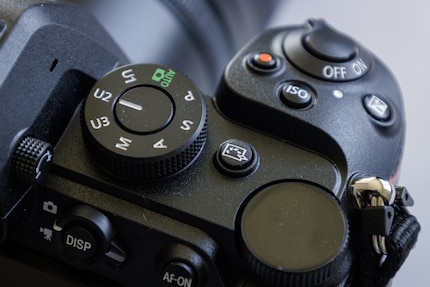 The Picture Control button next to the mode dial.