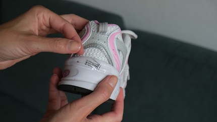 Attach double-sided adhesive tape to the shoe...