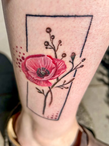 The poppy flower on my right leg is glowing.