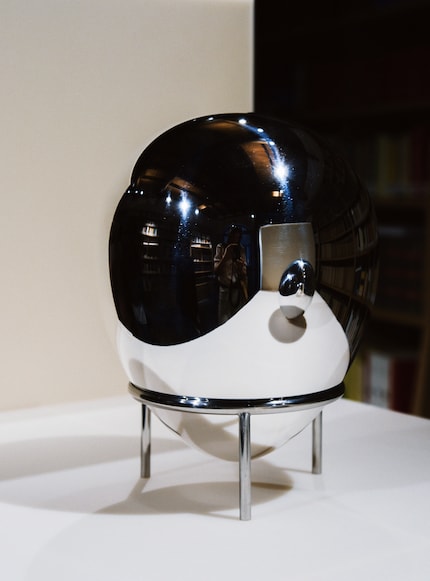 Michael Anastassiades' design is an egg-shaped urn made of metal.