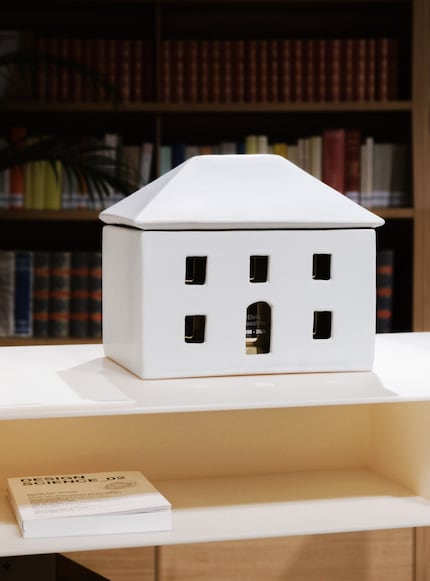 Michele De Lucchi and Naoto Fukasawa designed house-shaped urns - as a symbol of the last home.