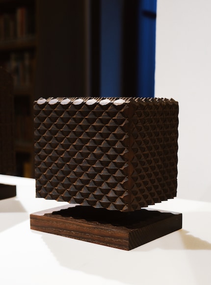 The urn by Michele De Lucchi takes the shape of a house.
