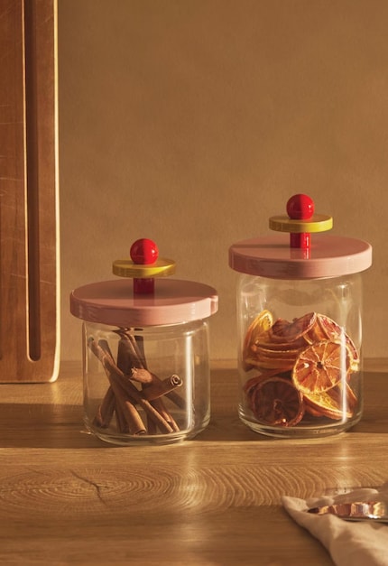 The Twergi storage jar combines timeless design with colourful elegance – inspired by Ettore Sottsass’ iconic style and made of glass and FSC-certified lime wood.