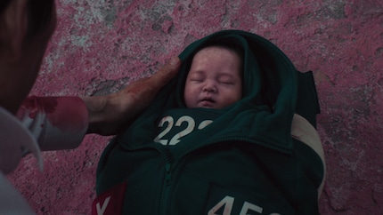 The baby is a symbol of innocence, hope and the future.