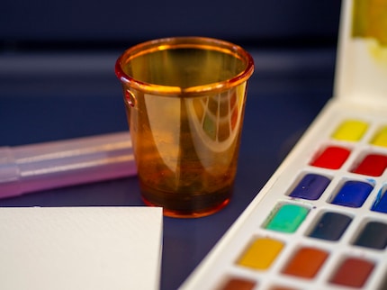 I wash my brush in the small shot glass.