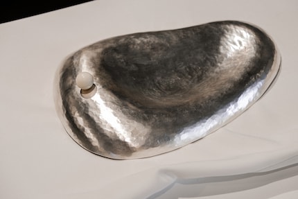 Ear Plate was made using a hammered technique and accentuated with a stone ball.
